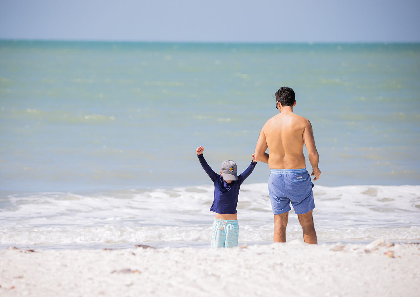dad and son at beach